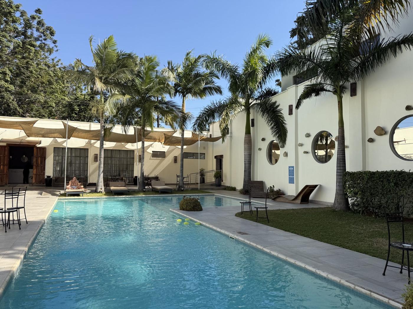Poolside courtyard with palm trees